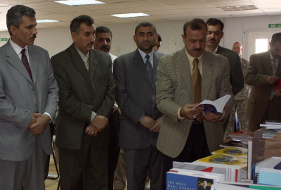 Dhi Qar University faculty examine ESL material donated by Book Wish Foundation