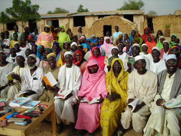 Note the books in their hands. By providing books and reading glasses to the 